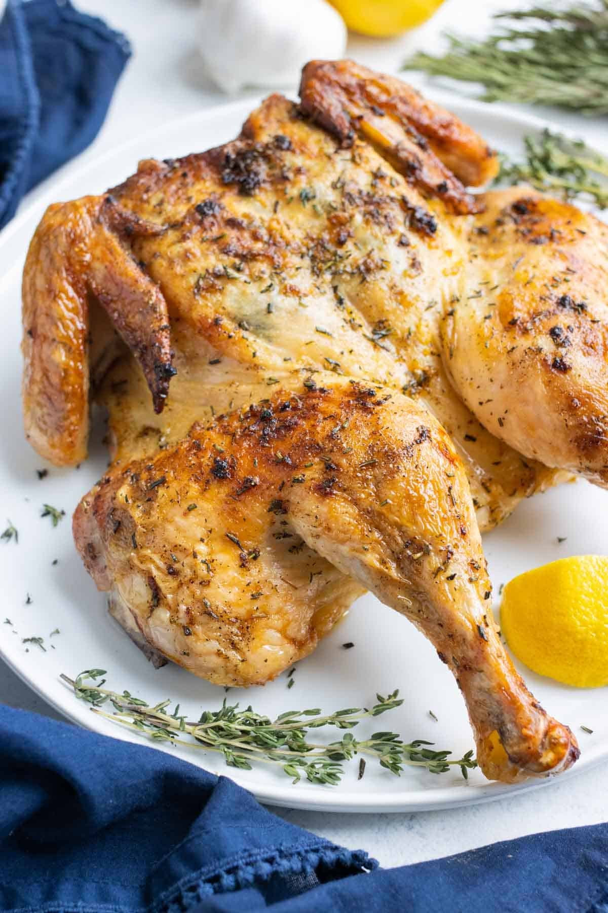 Close up of the crispy golden skin on an oven roasted spatchcock chicken.