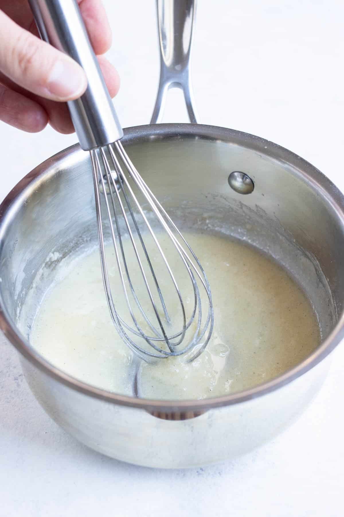 Flour is added to the butter for a cordon bleu sauce recipe.