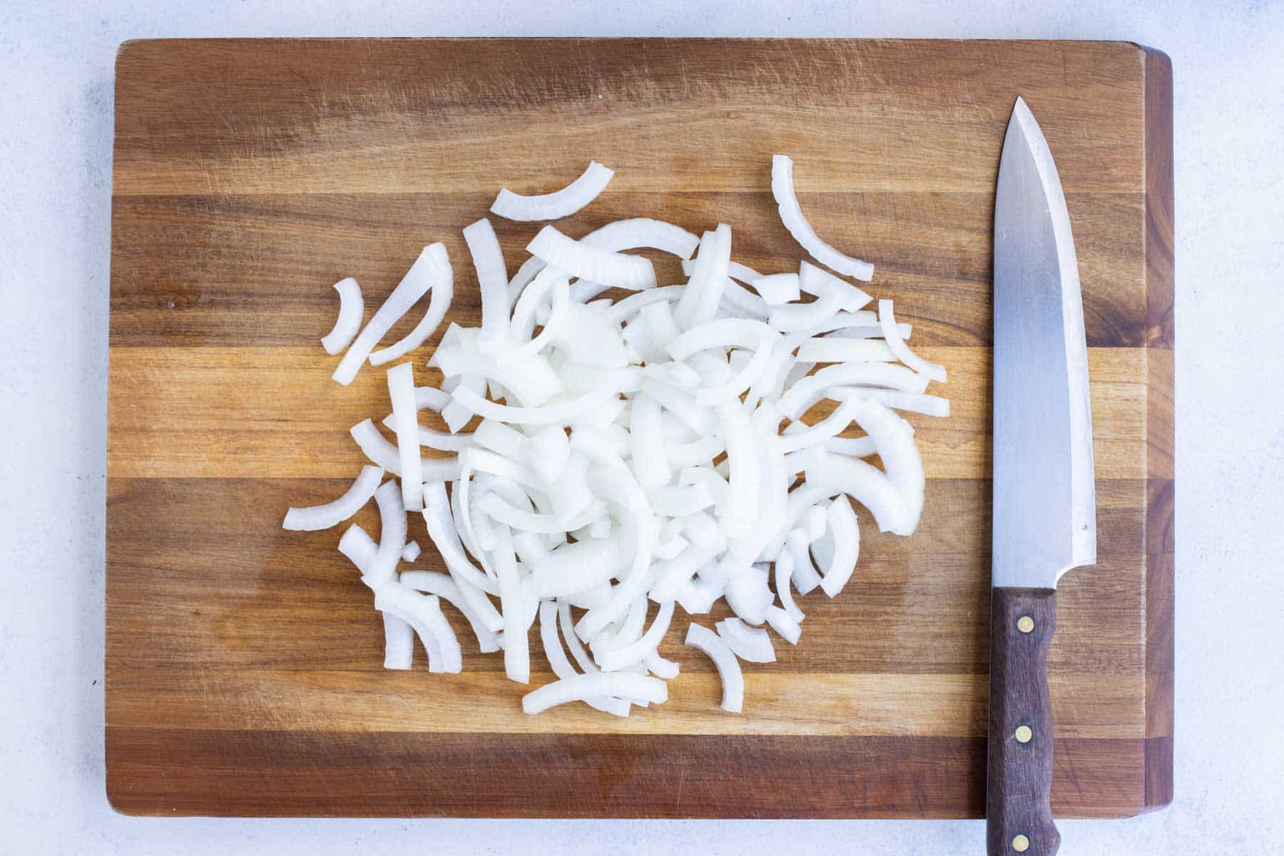 Thinly sliced onions are ready to make fried onion strings with.