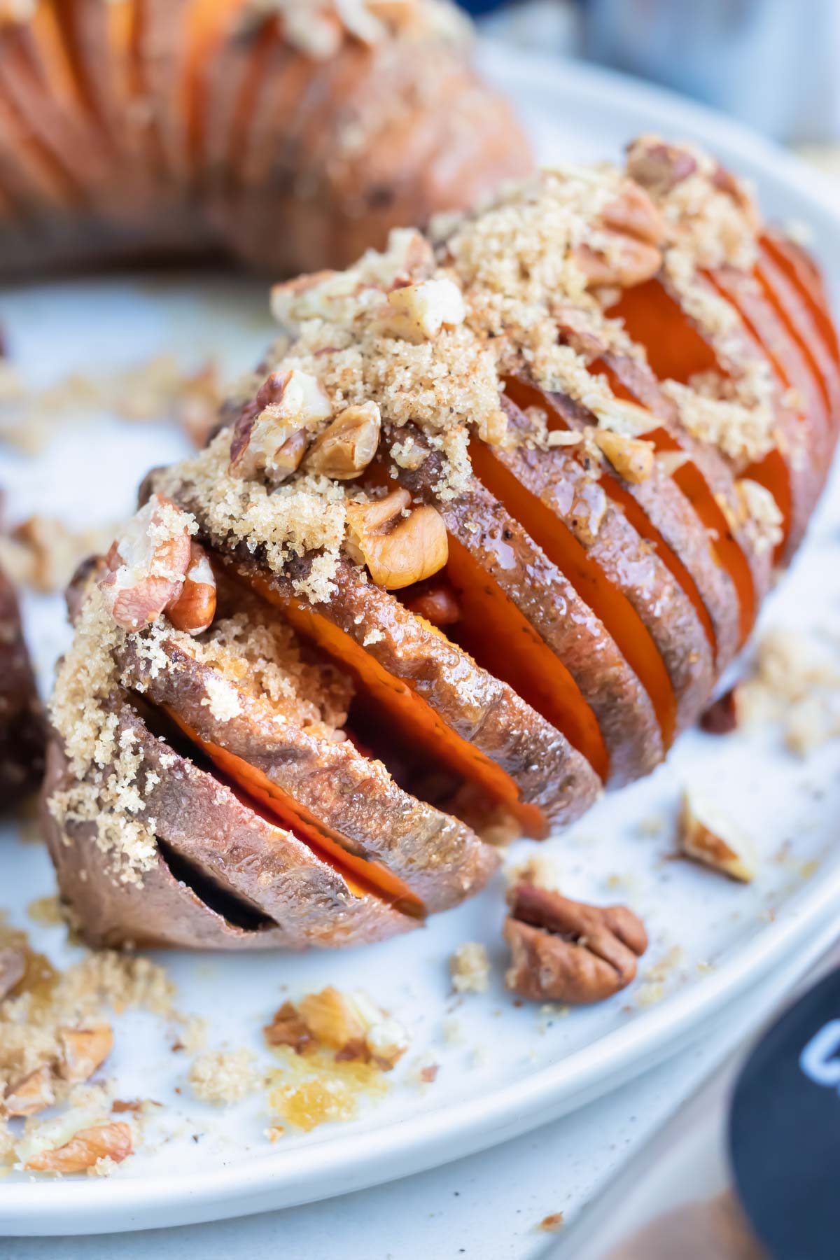 Baked hasselback sweet potatoes have all the flavors of your favorite Thanksgiving casserole.