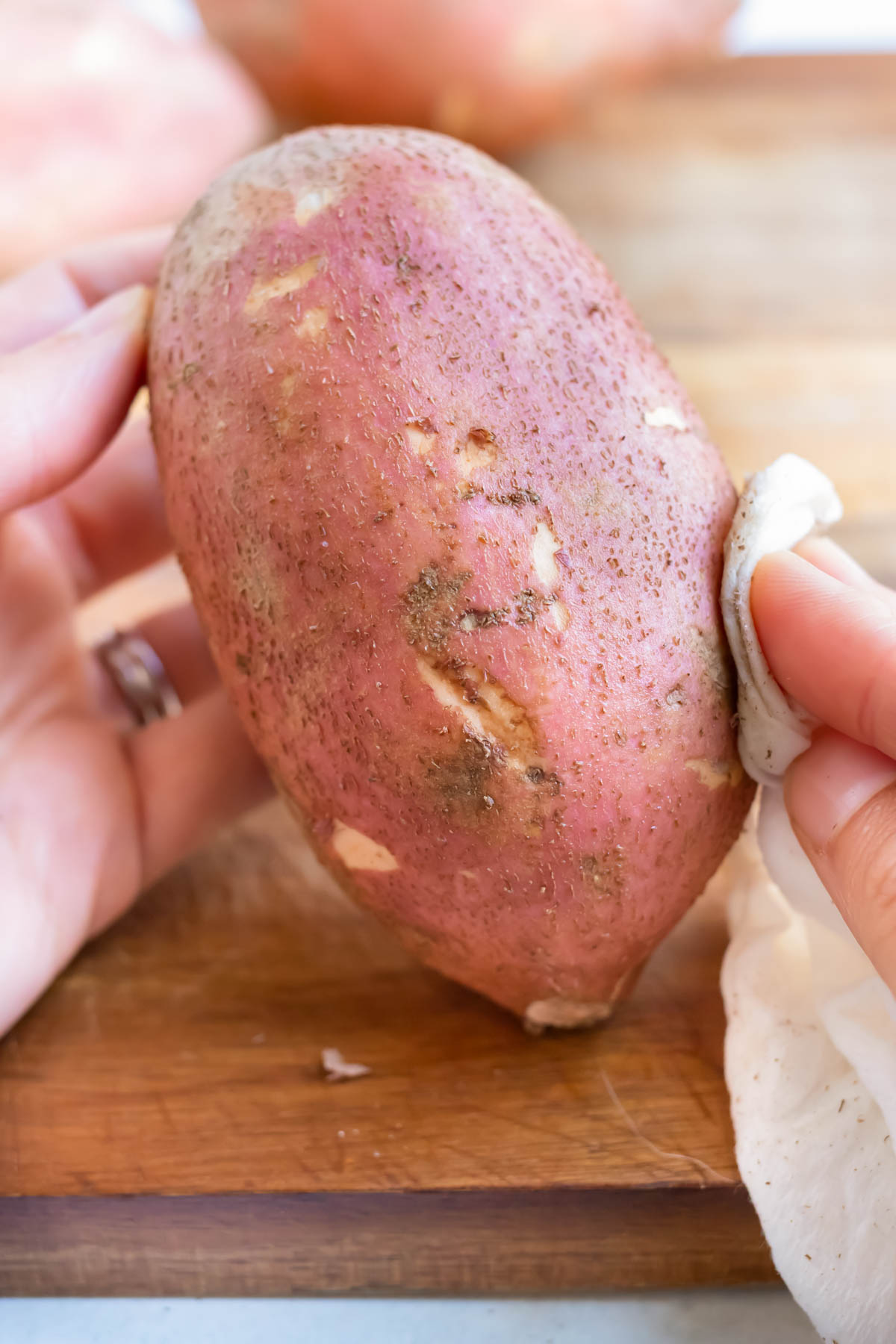 Sweet potatoes are washed for this side dish recipe.