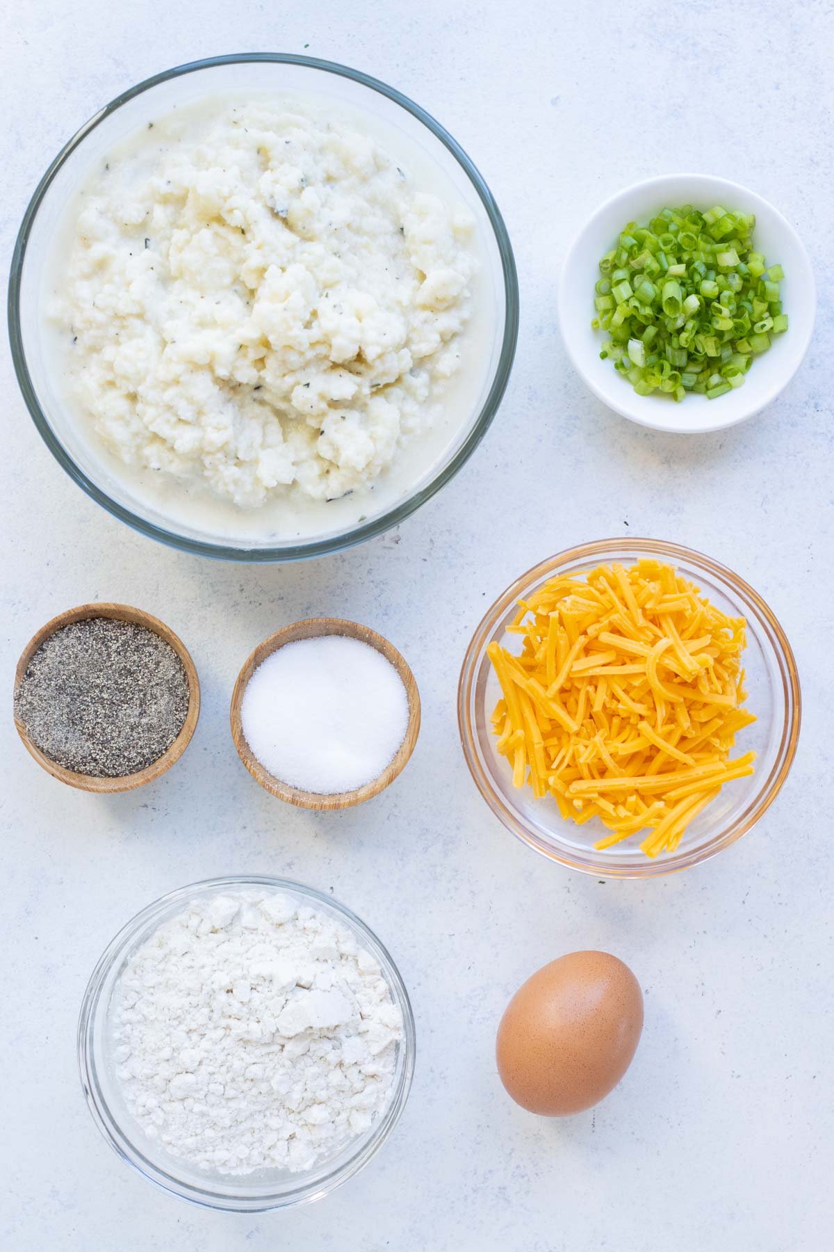 Mashed potatoes, cheese, flour, egg, and seasonings are the ingredients for these pancakes.