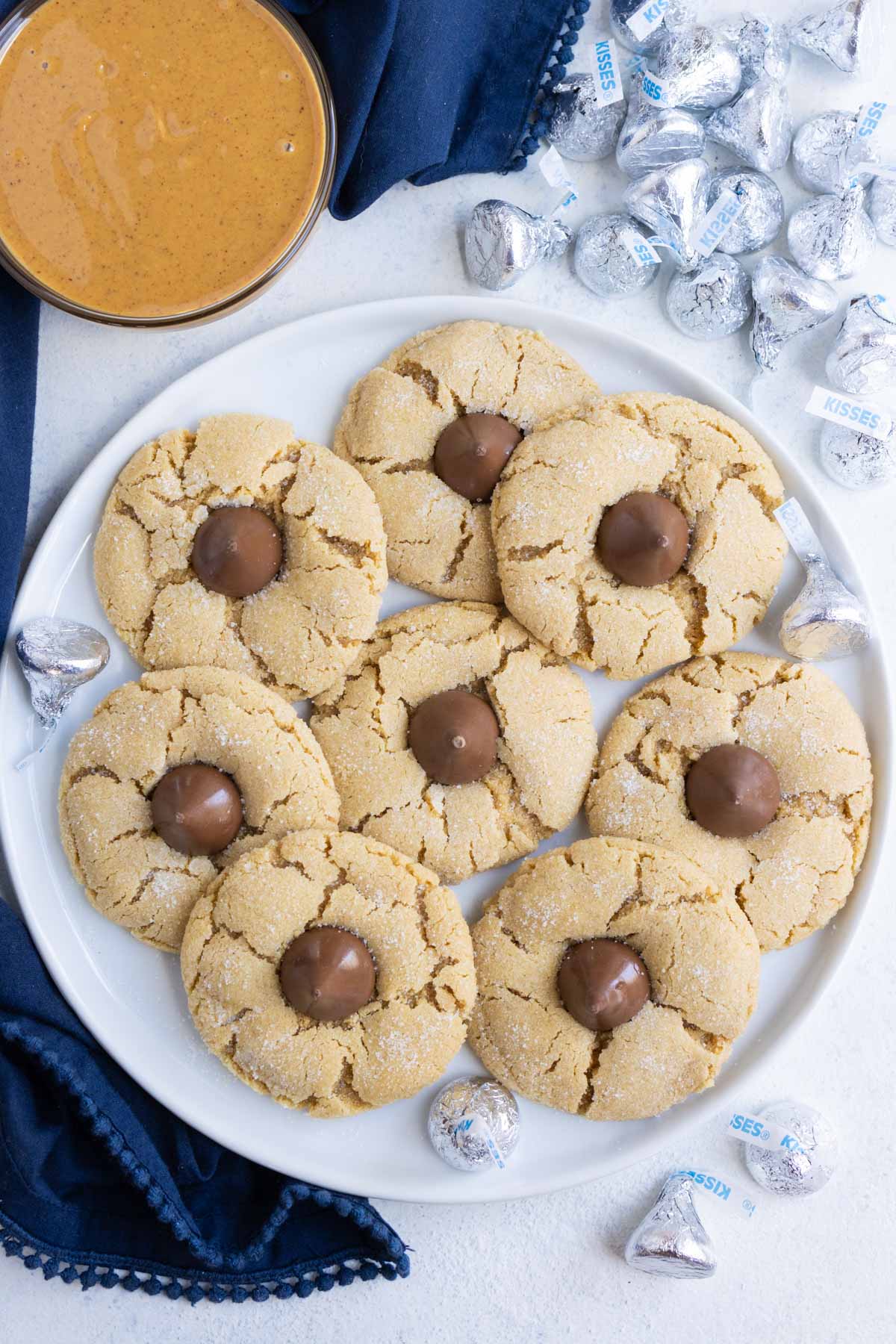 A plate full of peanut butter blossom cookies.