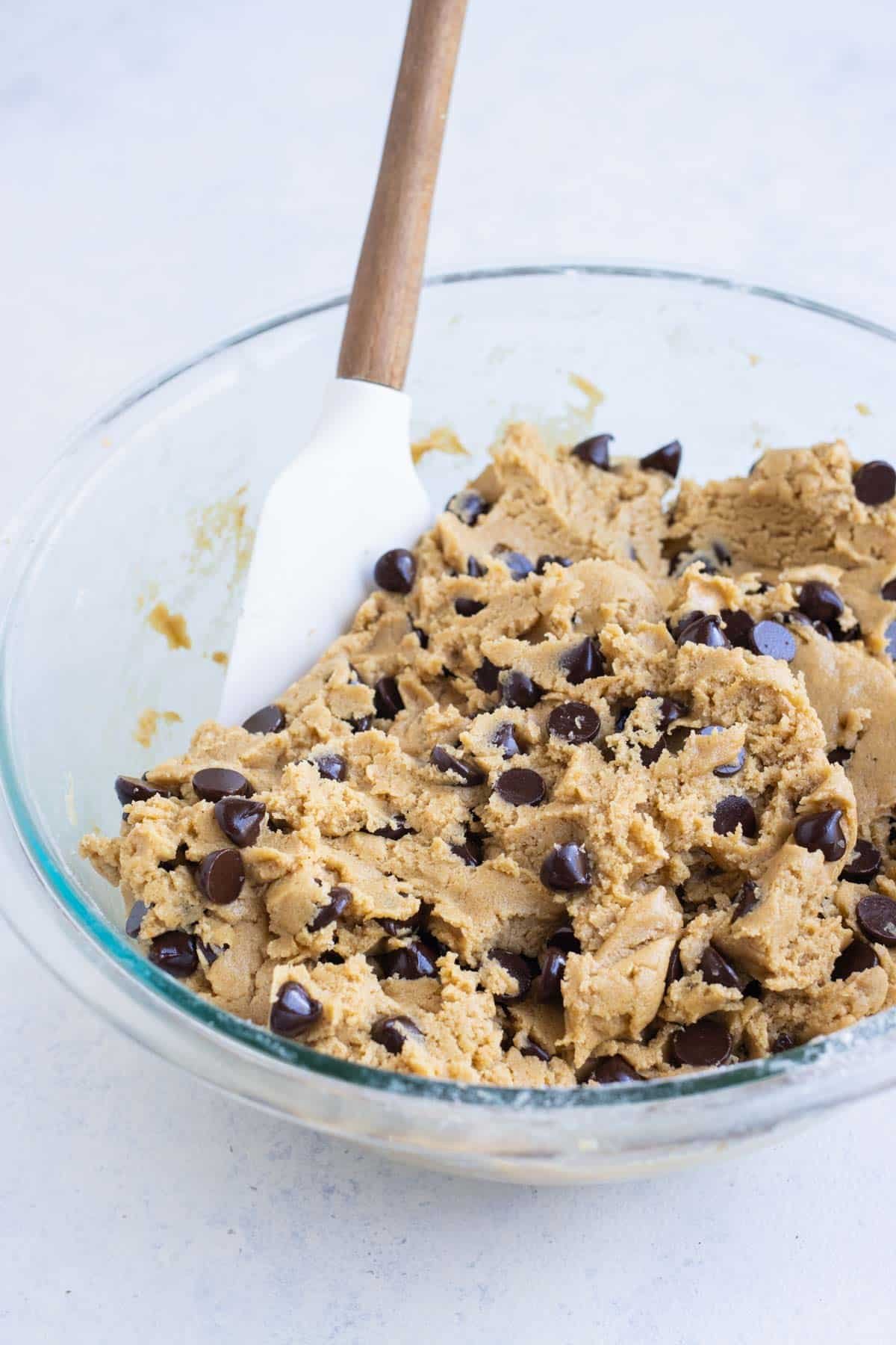 Chocolate chips are folded into the dough.