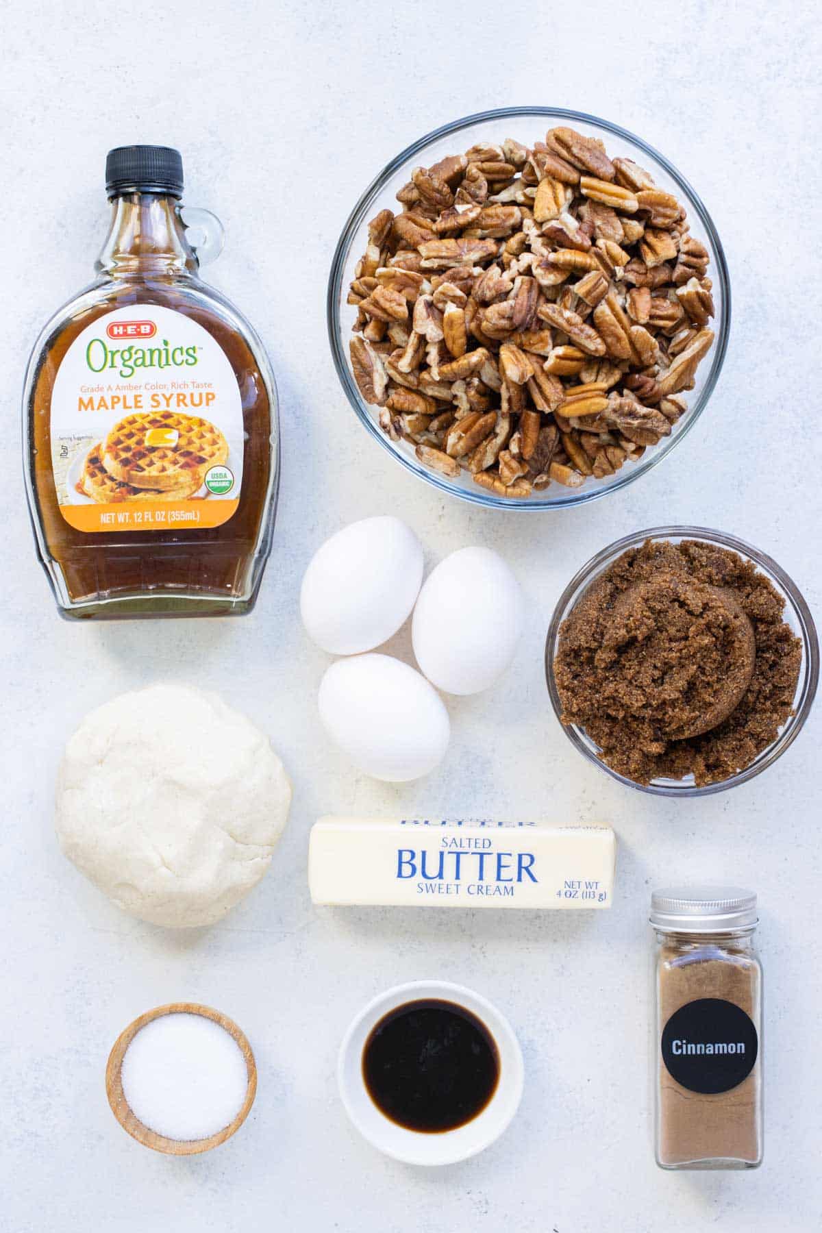 Pie dough, pecans, brown sugar, maple syrup, eggs, and butter are the ingredients in this recipe.