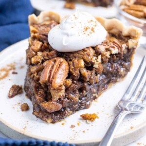 A slice of the best pecan pie without corn syrup on a white plate.