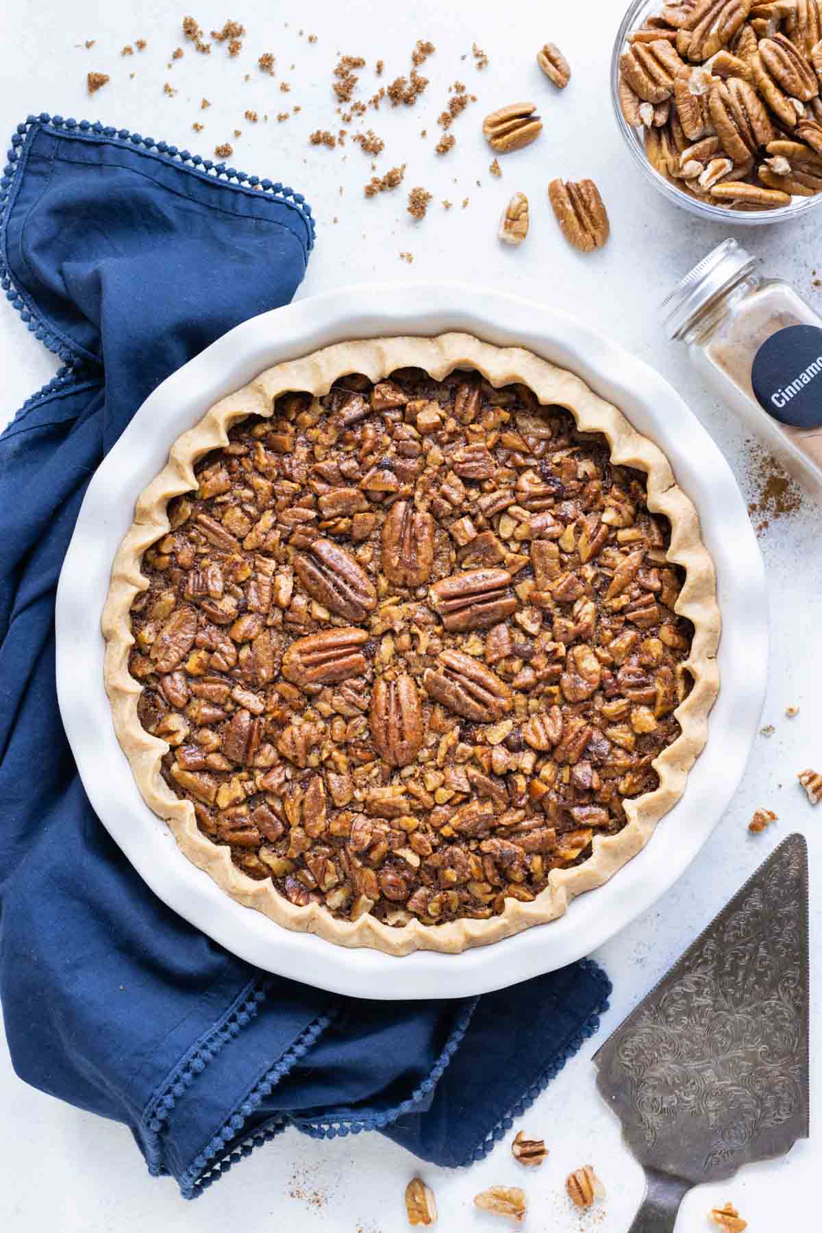 A whole pecan pie has a perfectly golden crust.