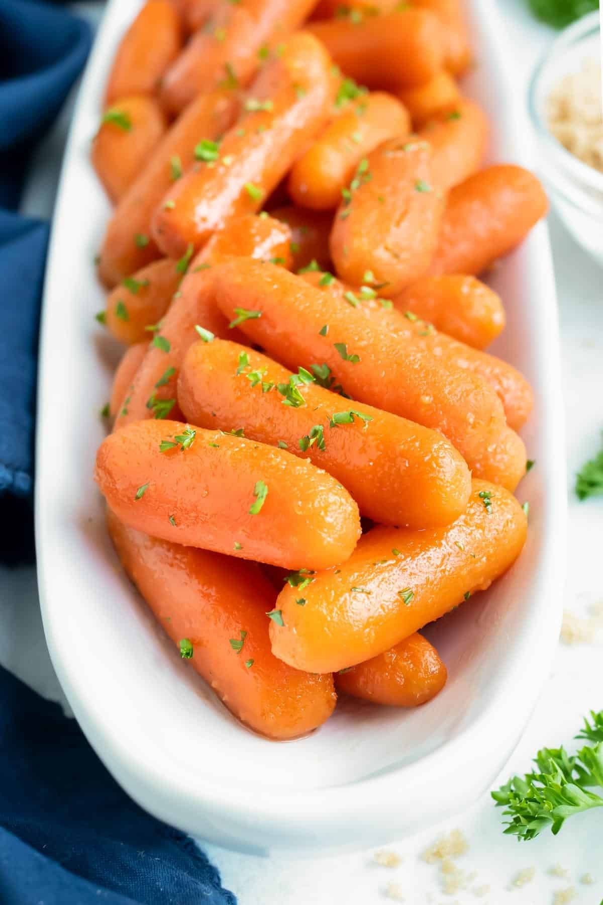 Easy Easter side dish for honey carrots with a brown sugar glaze that were made in a slow cooker.