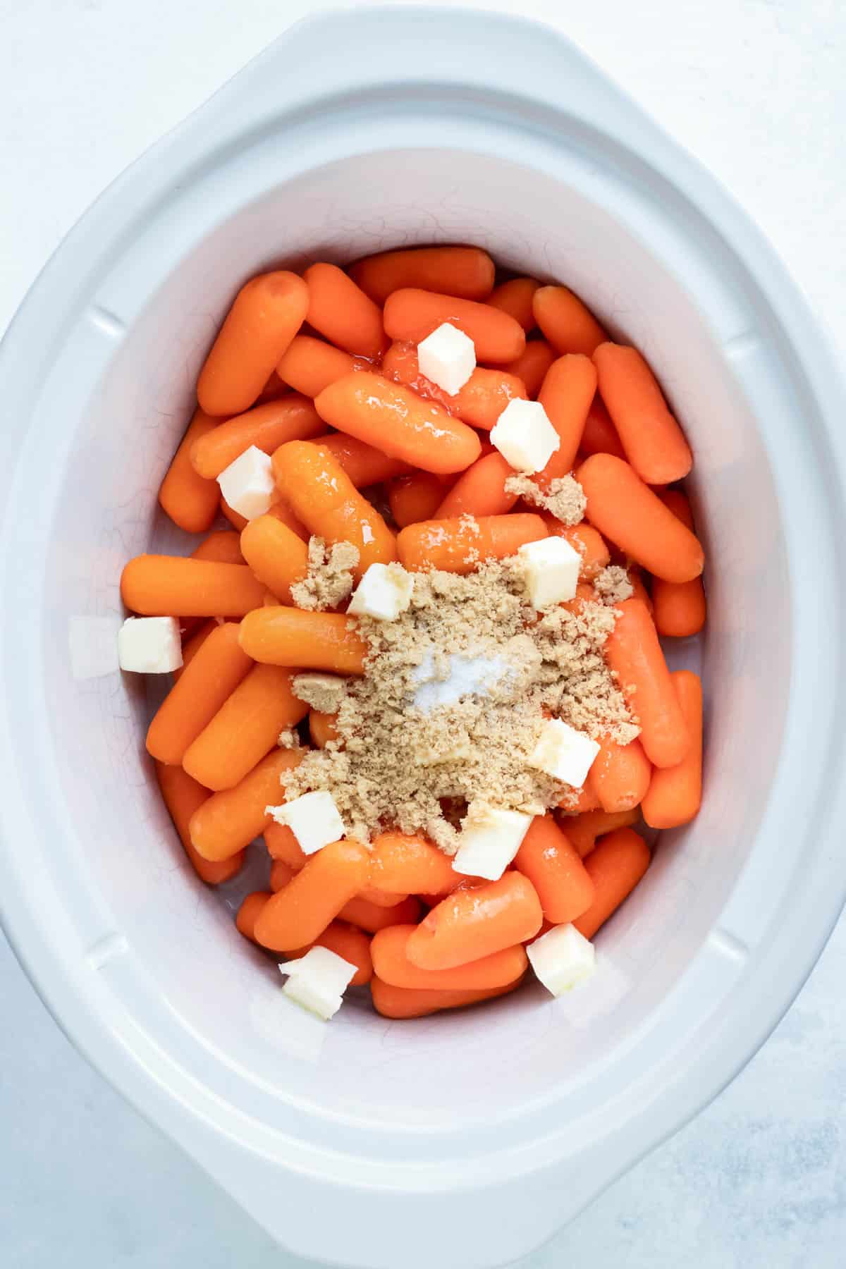 Carrots in a Crock-Pot with brown sugar and honey.