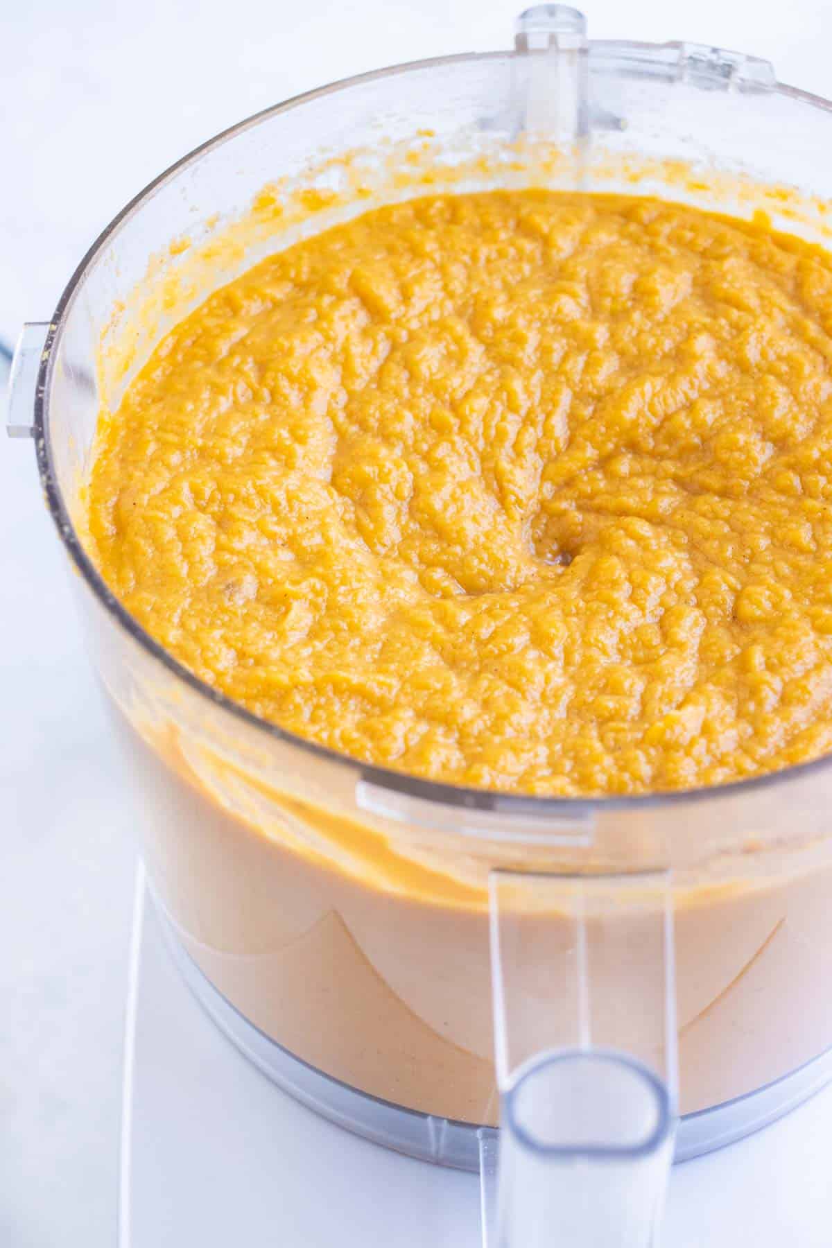 Sweet potato puree is blended in a food processor.