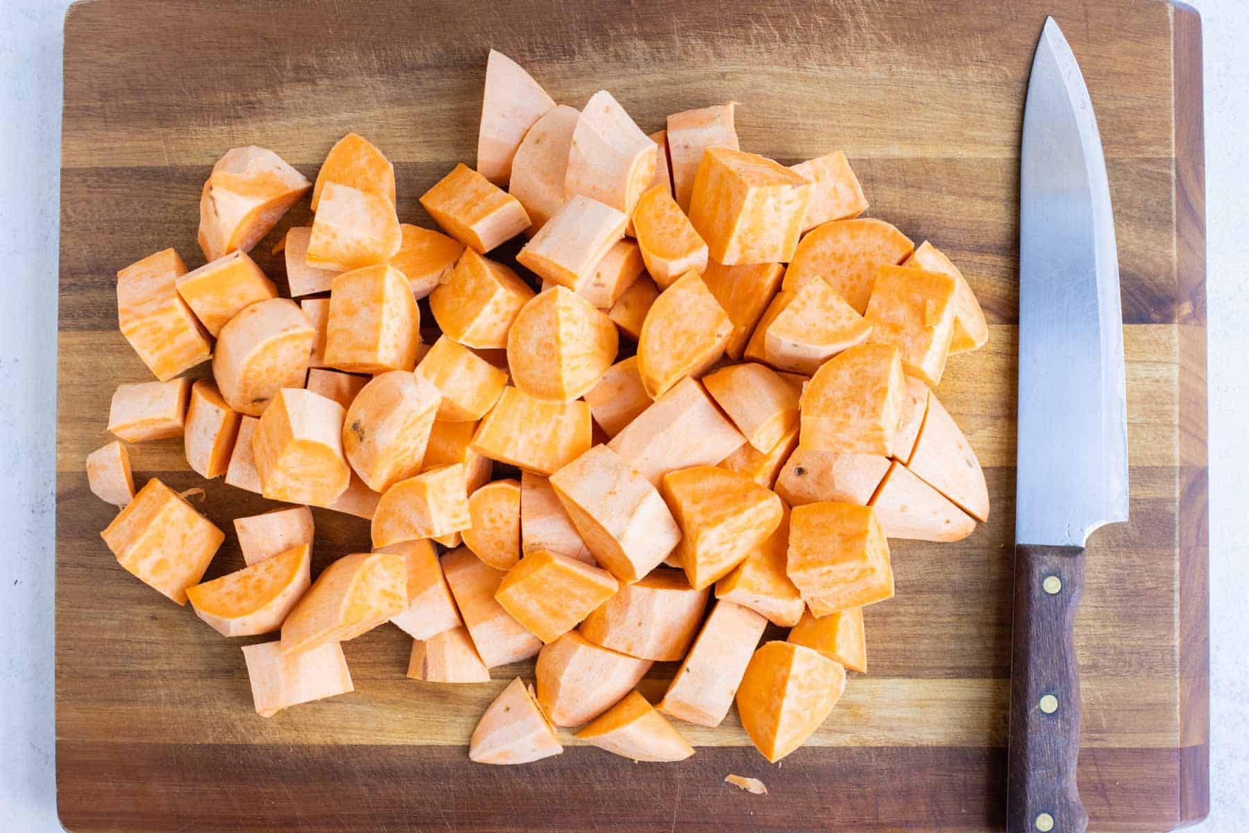 Diced and peeled sweet potatoes are ready to boil.