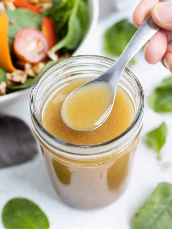 A jar full of apple cider vinaigrette.