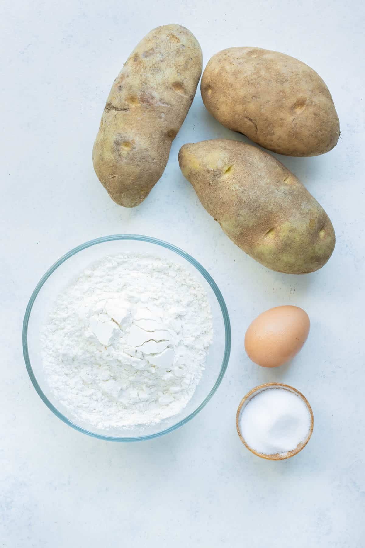Potatoes, egg, and flour are the ingredients for gnocchi.