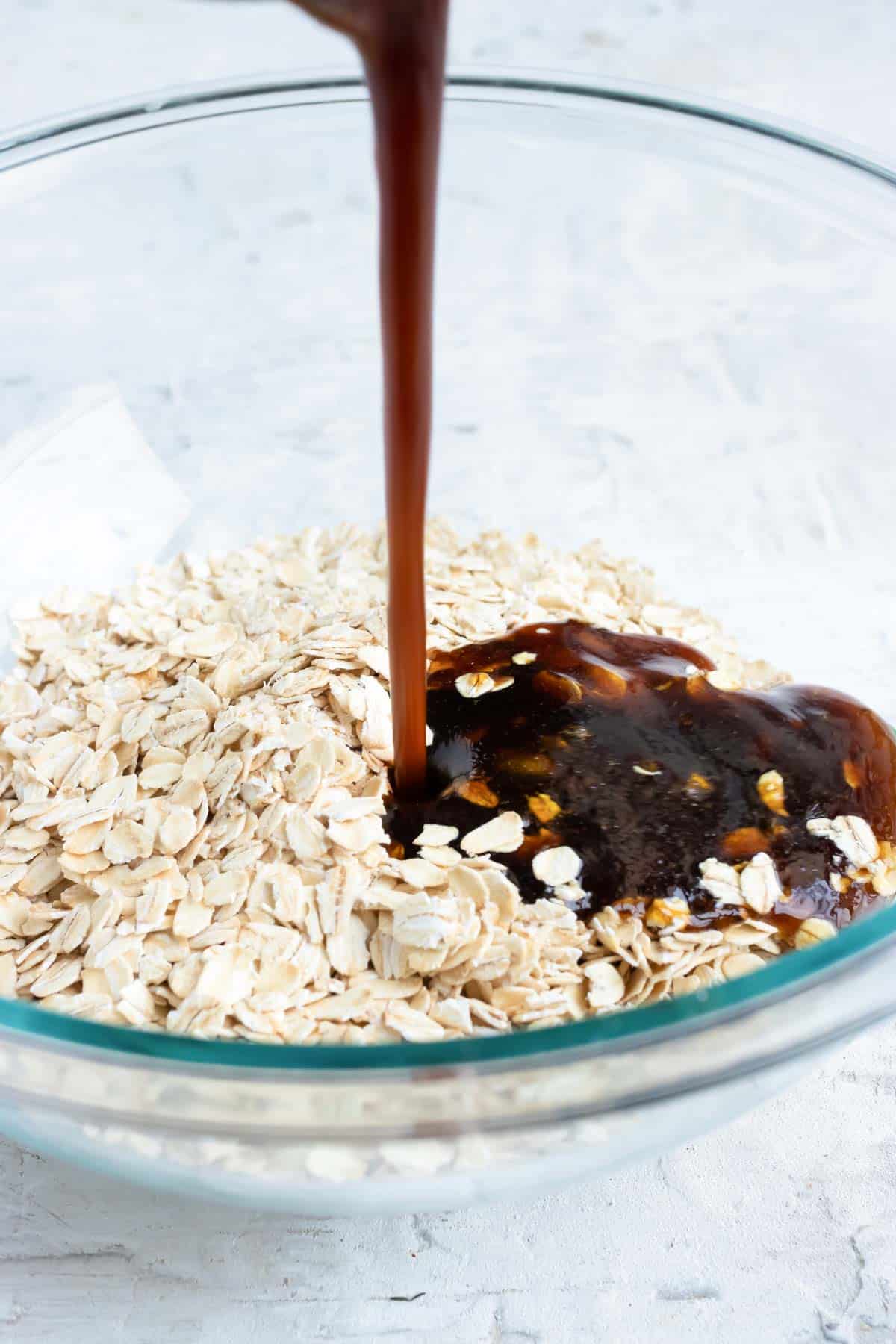 The maple syrup base is poured over gluten-free oats.