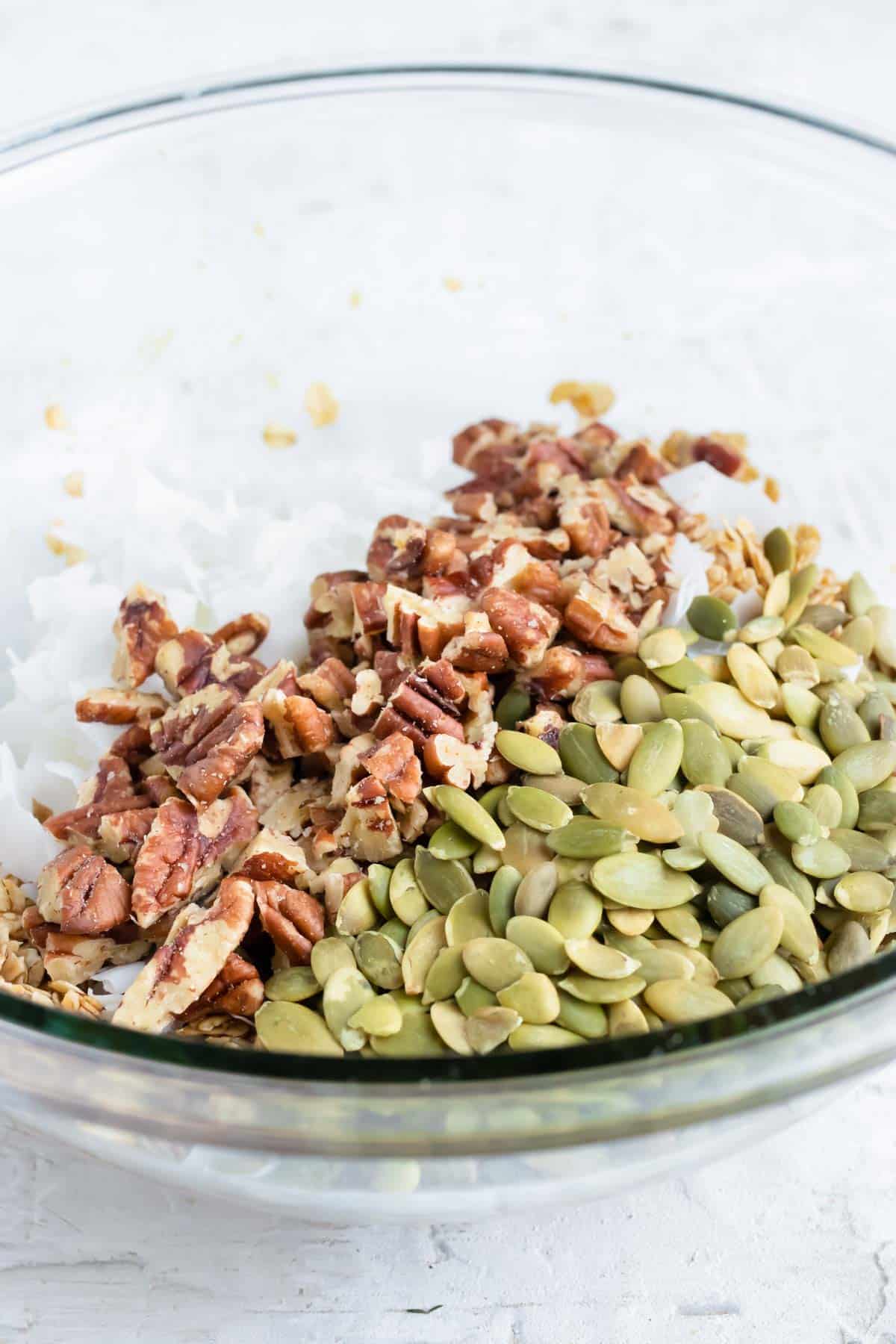 Pecans, coconut, and pumpkin seeds are added.