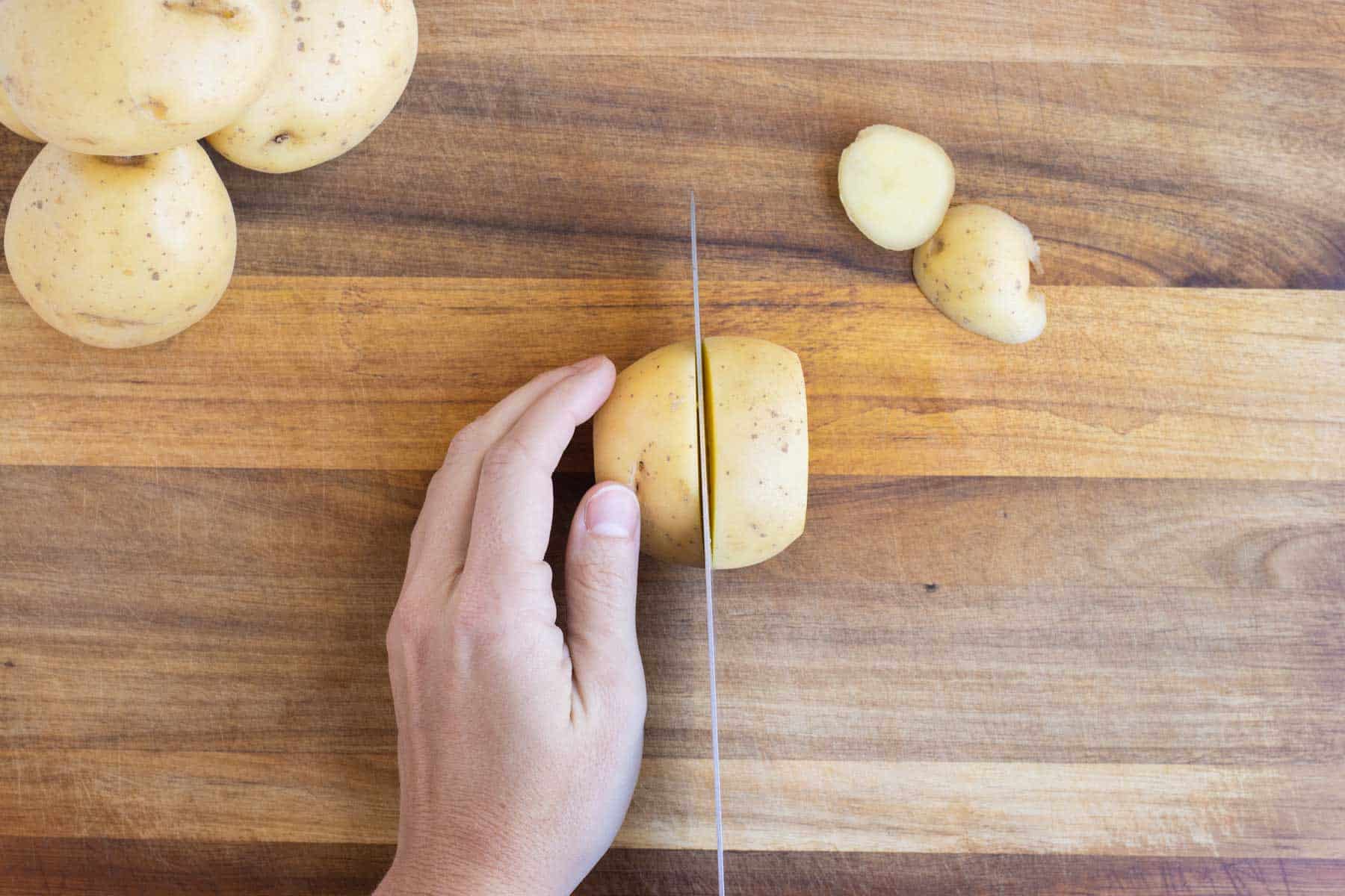 A potato is sliced in half.