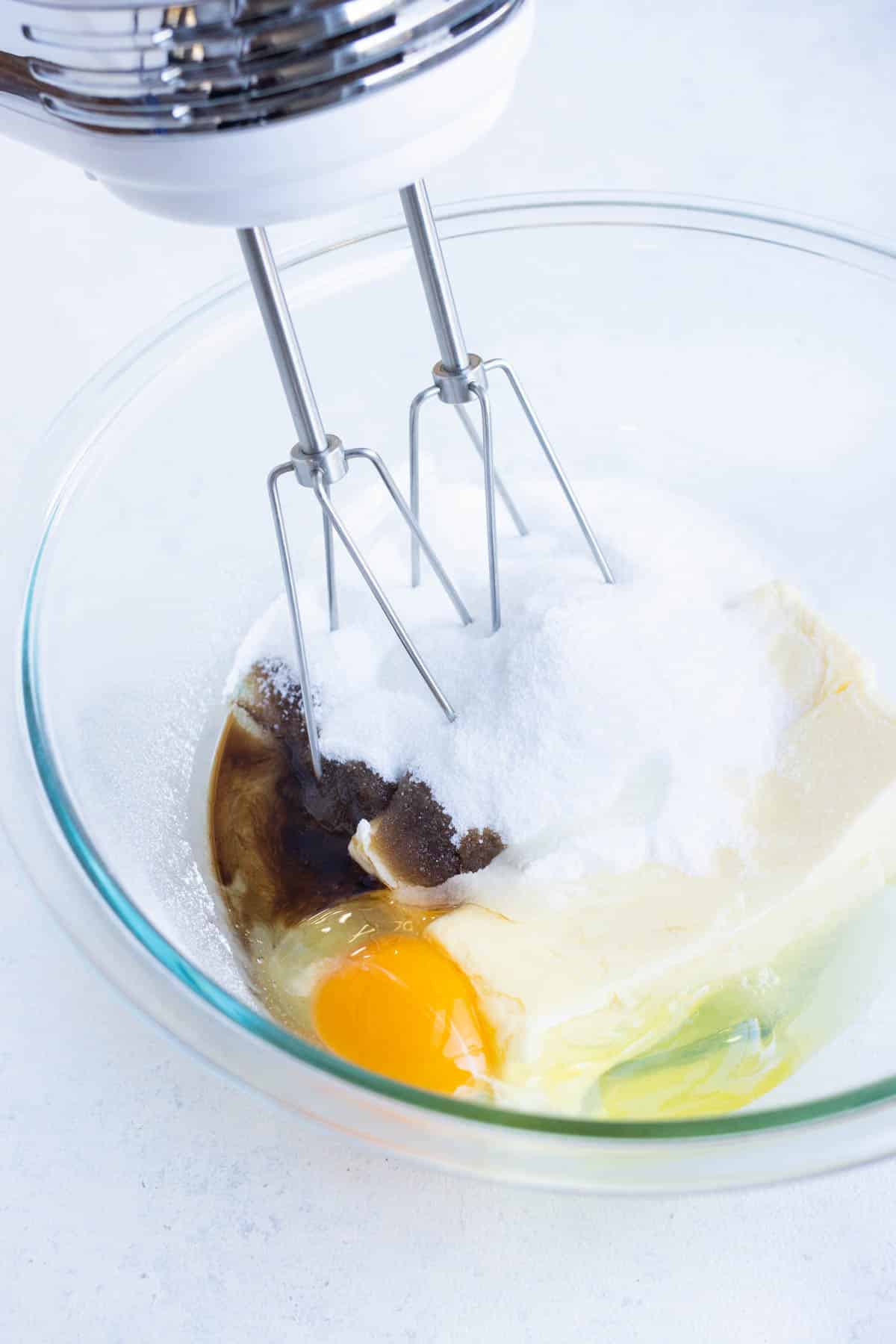 Egg, butter. sugar, and vanilla are mixed together.