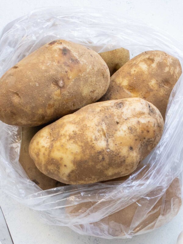 A bag full of russet potatoes.