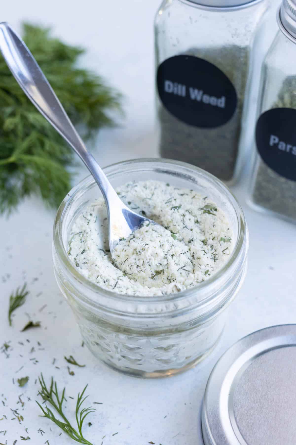 Ranch seasoning is stored in a small jar.