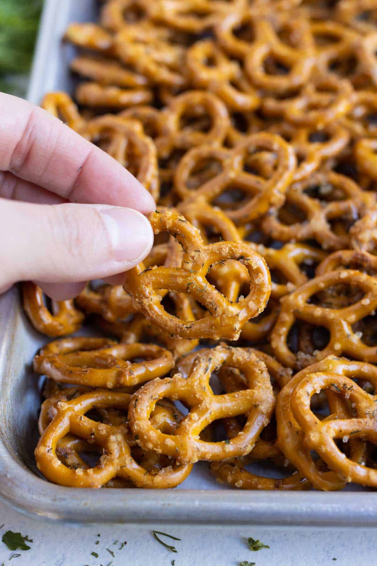 A close up of a pretzel seasoned with a butter ranch mixture.