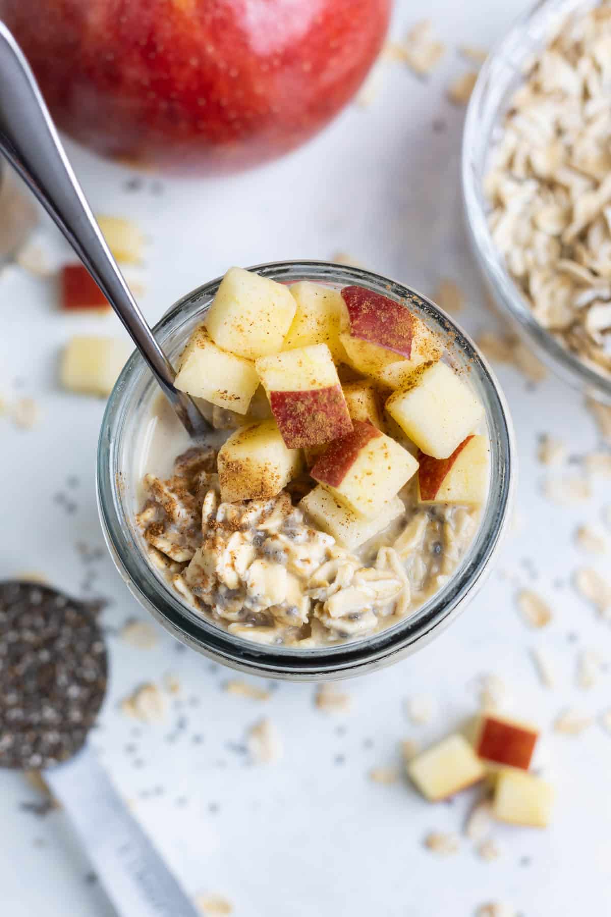 Overnight oats made with apples and cinnamon in a glass for an easy breakfast.