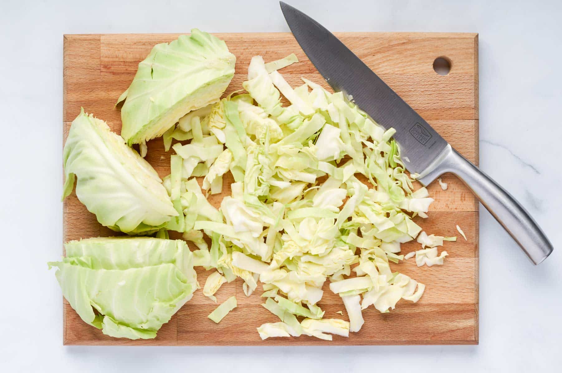 Cabbage is sliced thin for this dish.