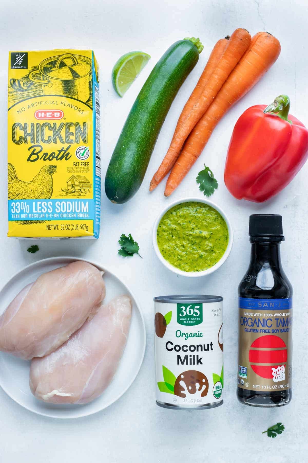 Chicken, carrots, bell peppers, soy sauce, green curry paste, coconut milk, and other ingredients are used to make Green chicken curry.
