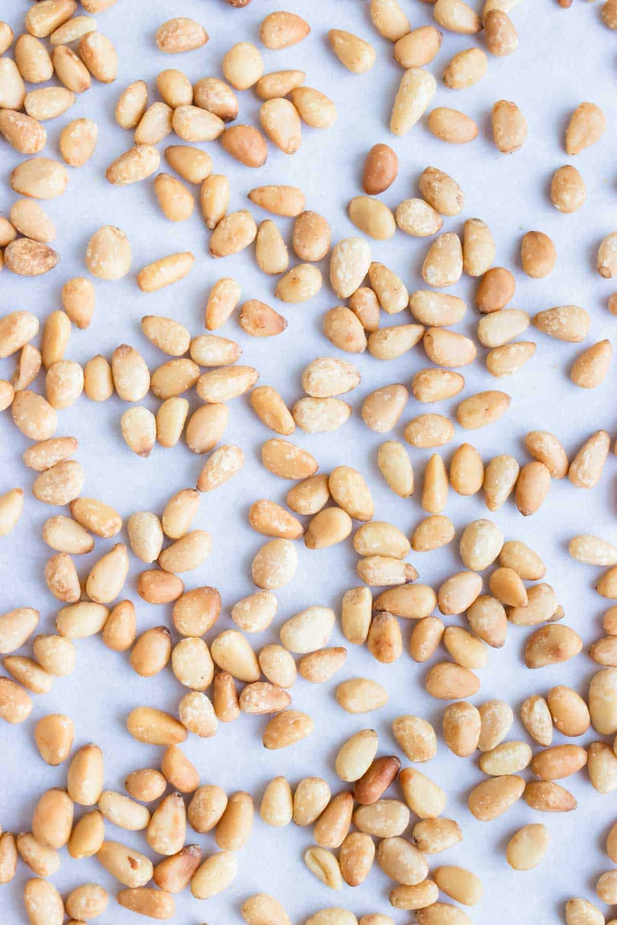 Roasted pine nuts are a golden brown color with a buttery, nutty flavor.