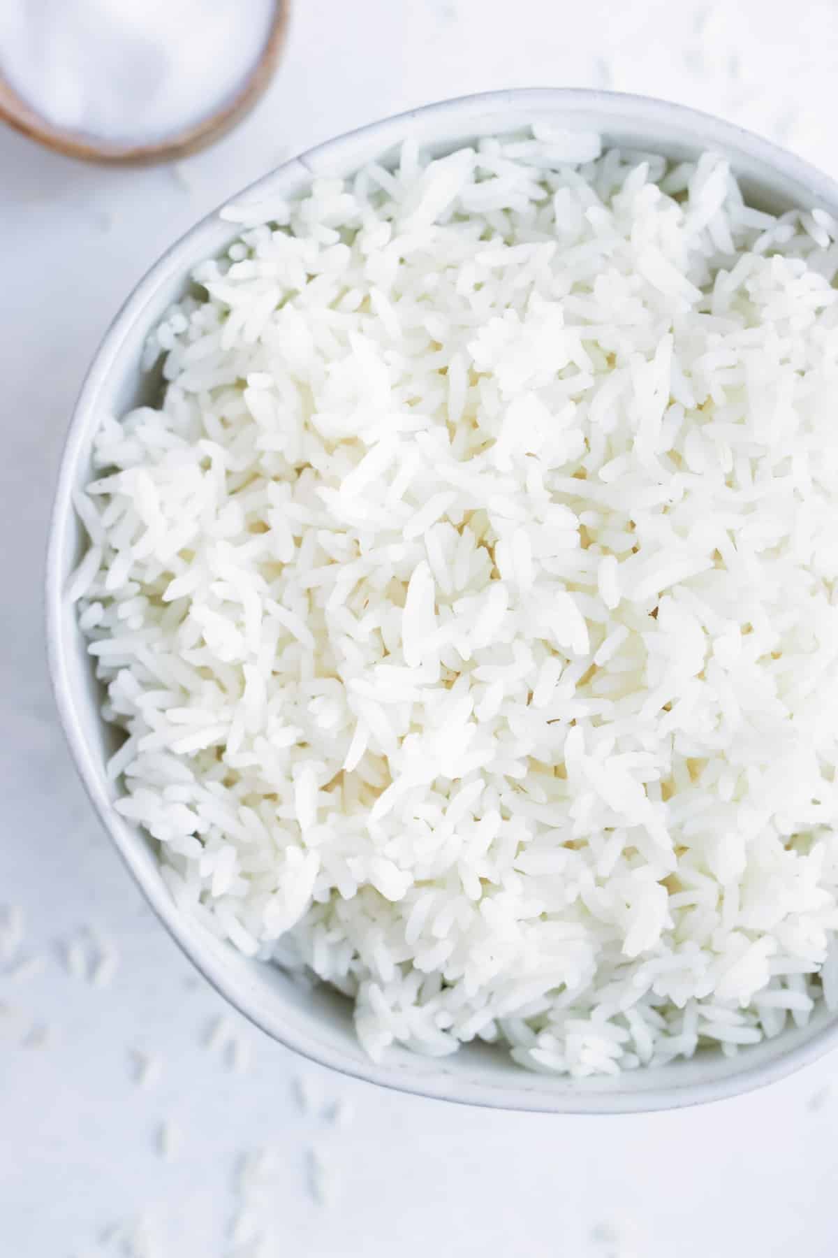 White rice served in a white bowl.