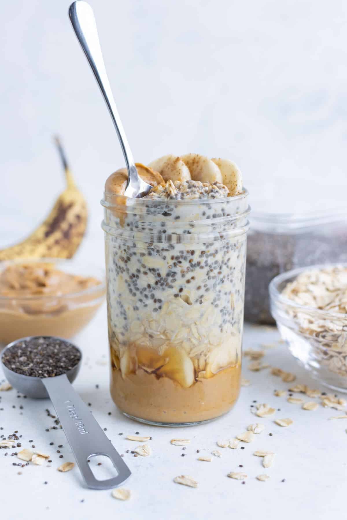 Creamy oatmeal is mixed with peanut butter and bananas for a healthy breakfast.