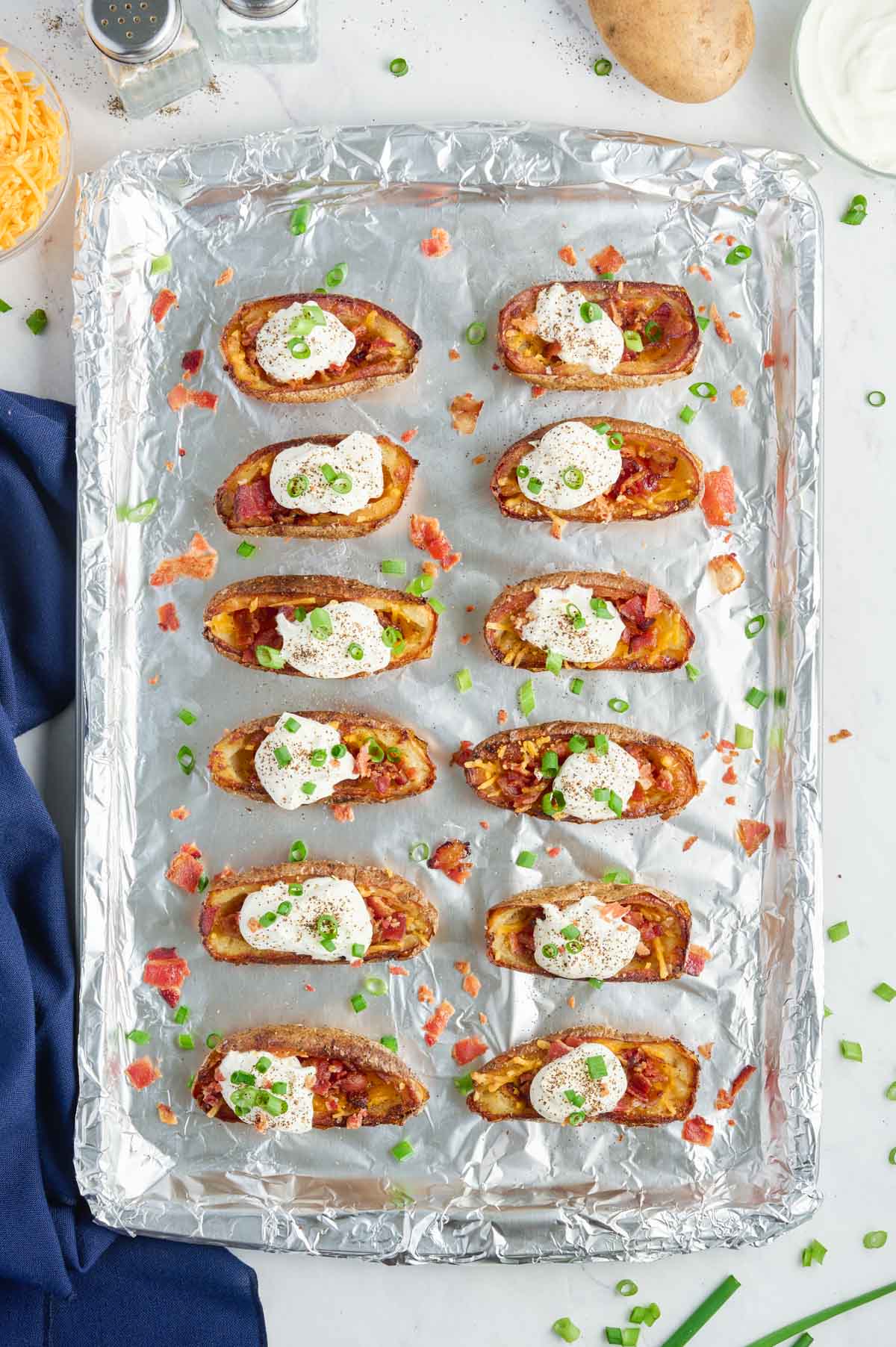 Potato skins are loaded with sour cream and chives.