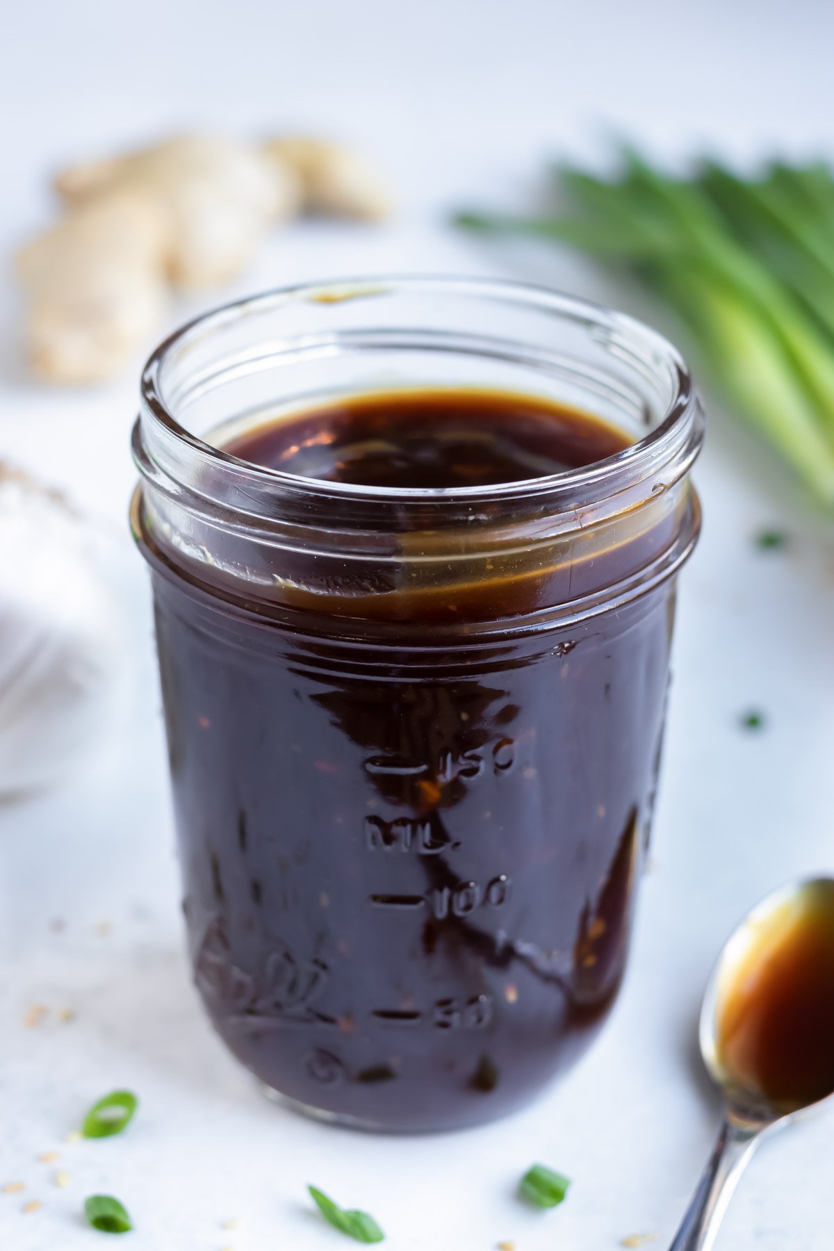 Gluten-free teriyaki sauce being stored in an airtight glass mason jar.