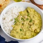 Healthy and flavorful chicken korma curry is served in a bowl with rice.