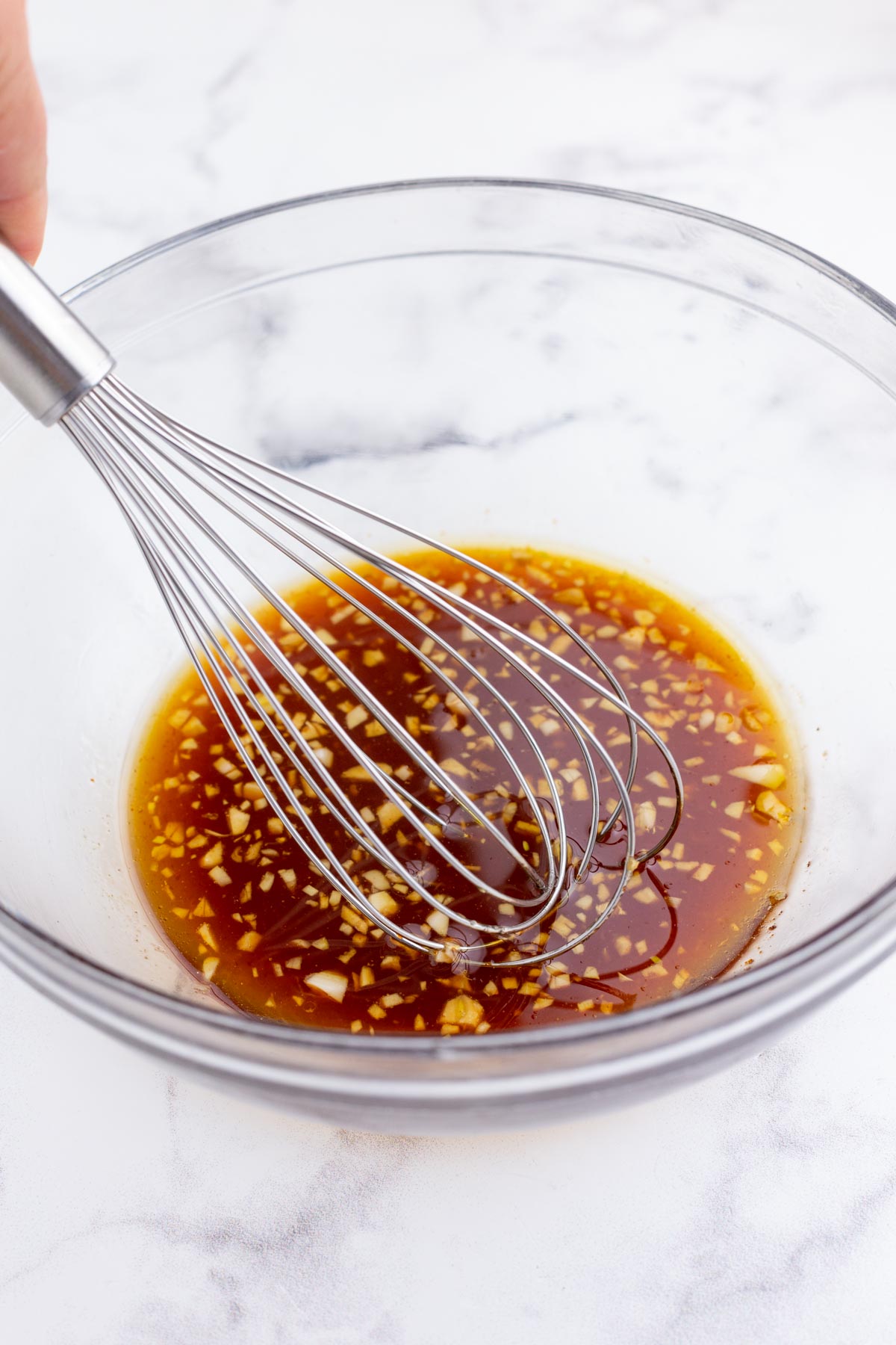 Marinade ingredients are whisked together,