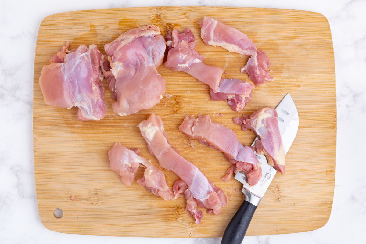 Chicken is sliced into strips.
