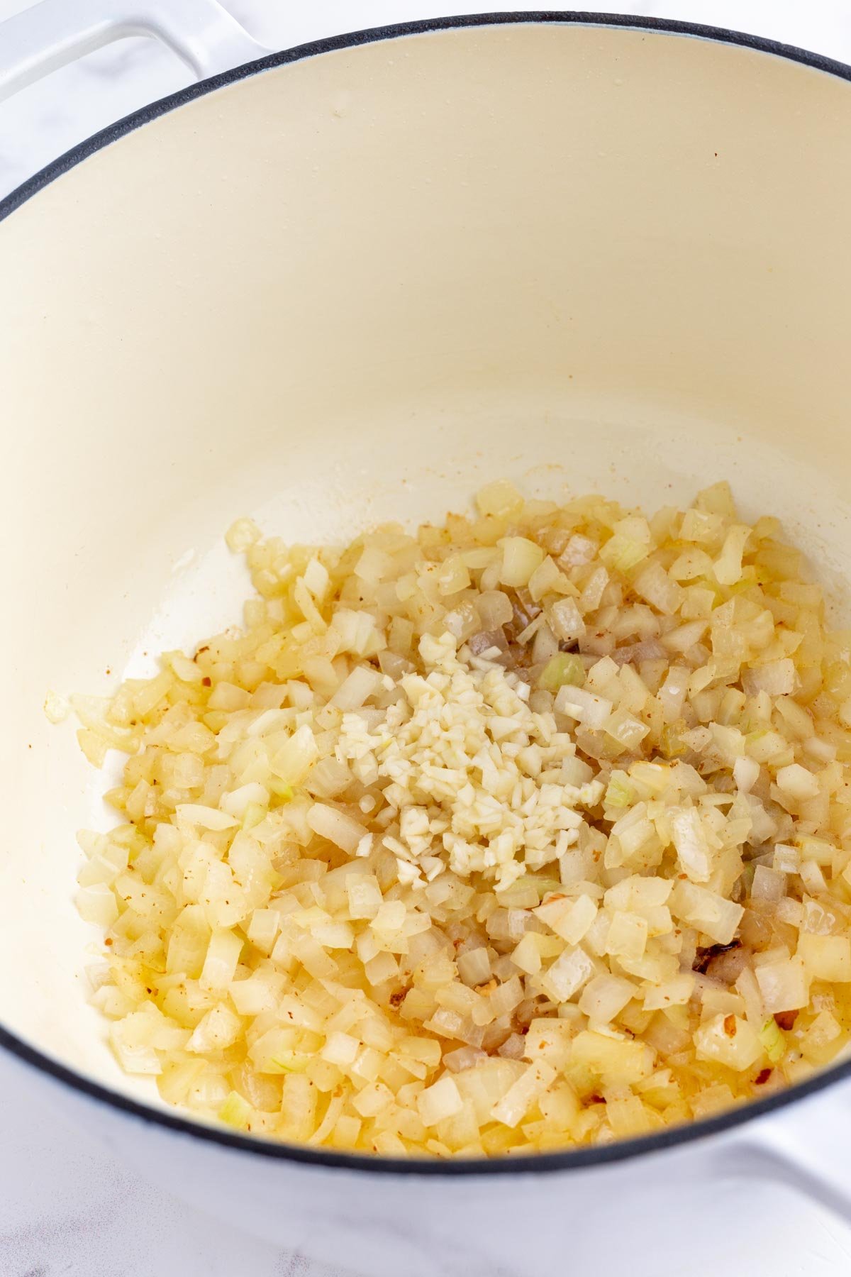Garlic is added to the cooked onions.