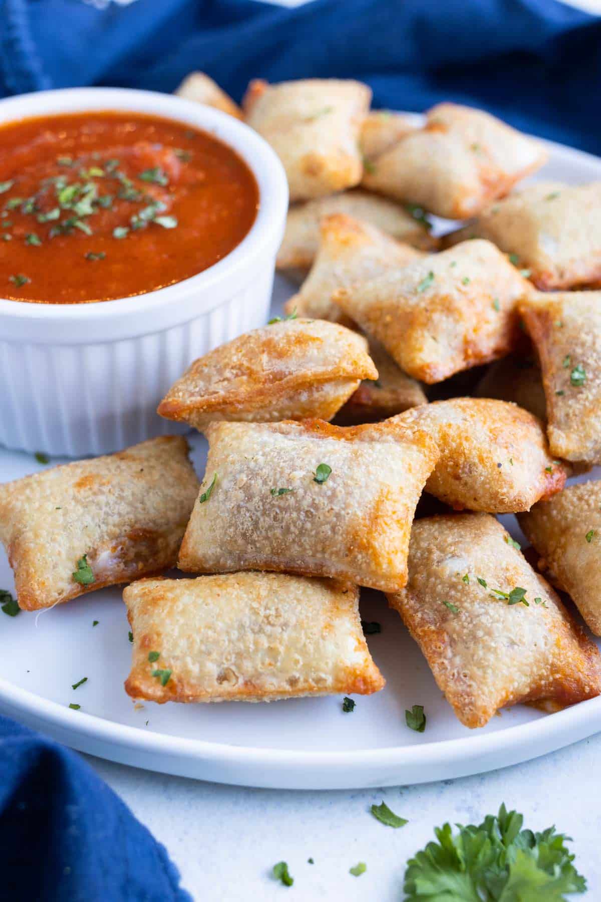 Air fryer pizza rolls are easy to make and perfect for a party.