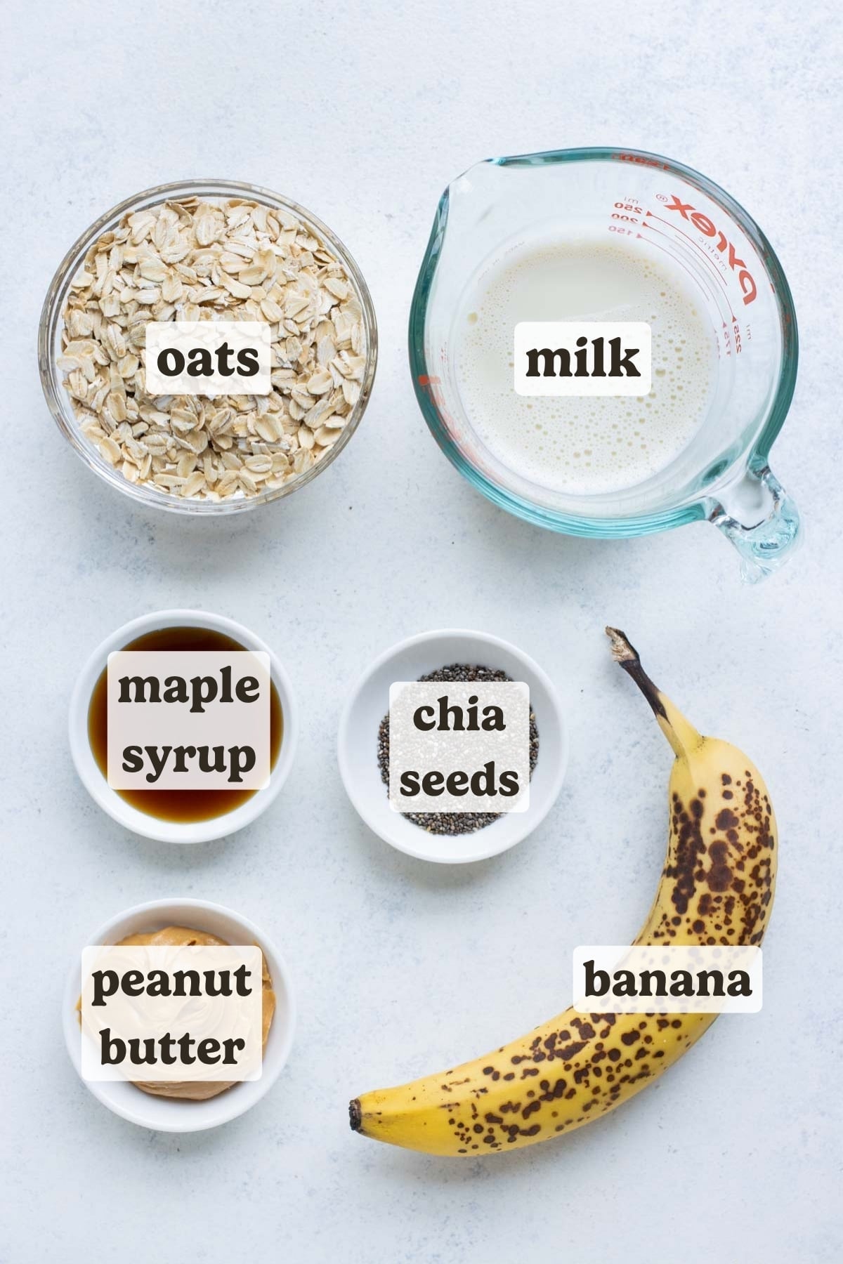 Banana, oats, peanut butter, milk, and sweetener are the ingredients for this overnight oats recipe.