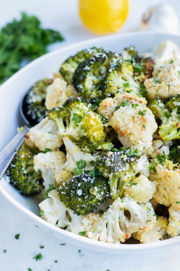Parmesan roasted cauliflower and broccoli are a low carb vegetarian side dish.