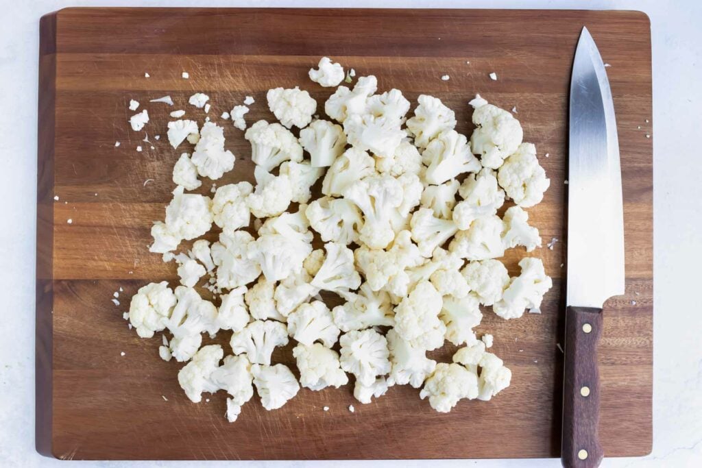 Cauliflower chopped into even florets for oven roasted broccoli and cauliflower.