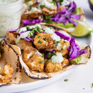 Roasted Cauliflower Tacos with Cilantro Lime Cream Sauce | Vegan