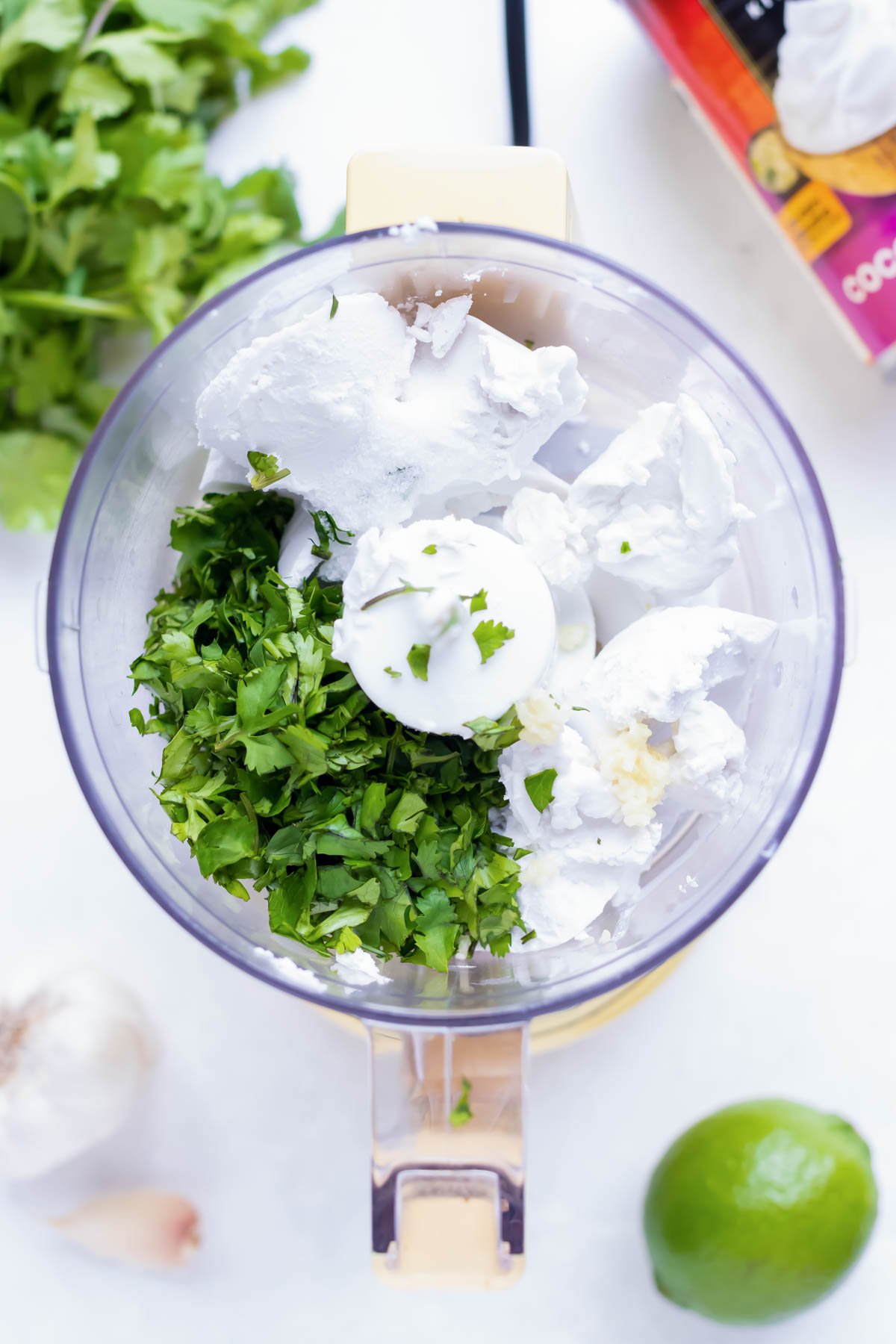 Cilantro, coconut cream, lime juice, and garlic in a food processor.