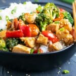 Healthy teriyaki chicken bowl with vegetables and white rice.