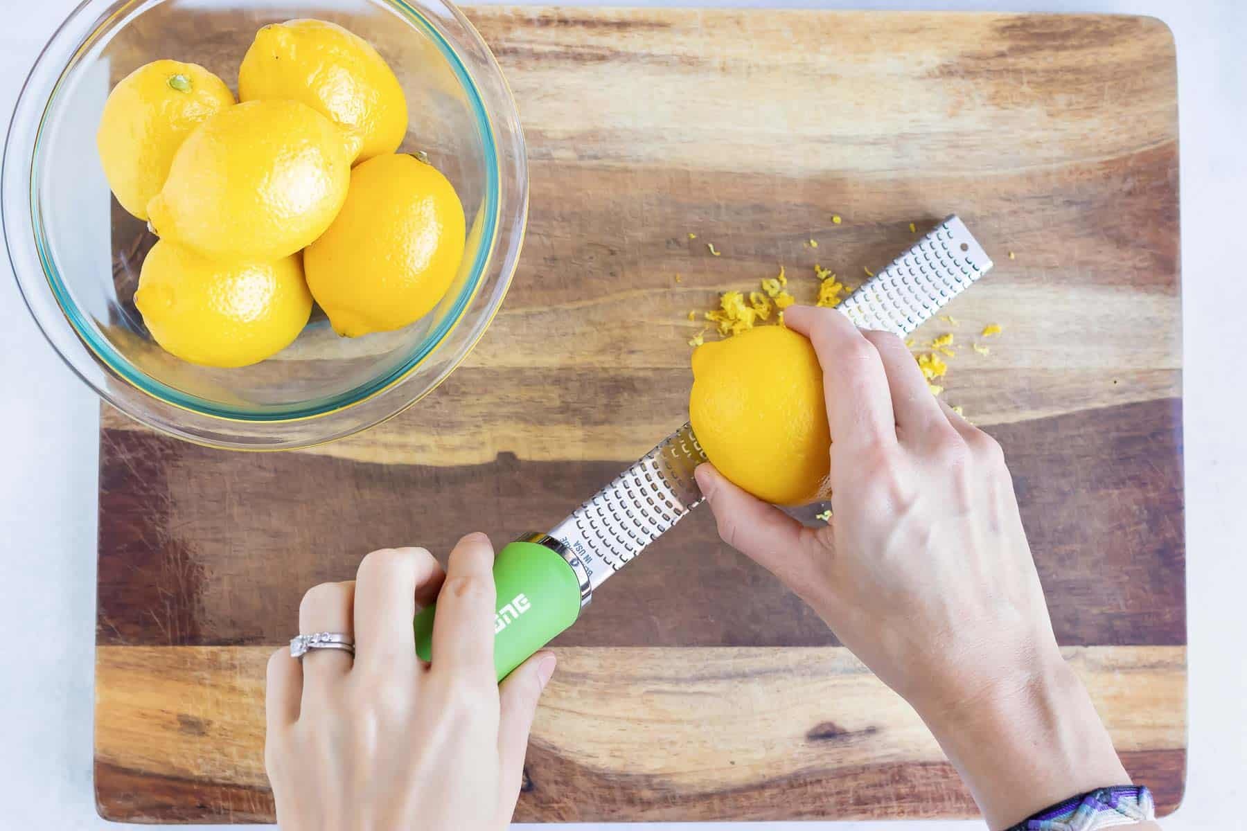 Using a microplane to zest a lemon.