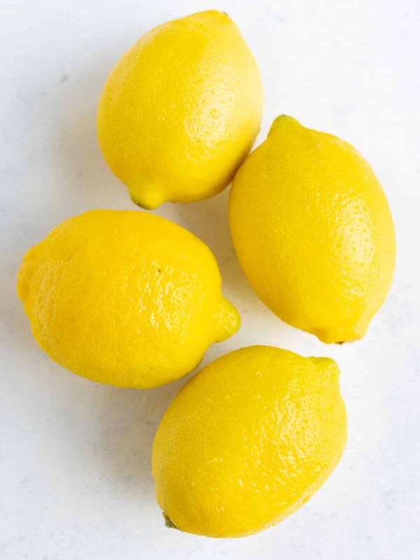 Four lemons on the countertop.
