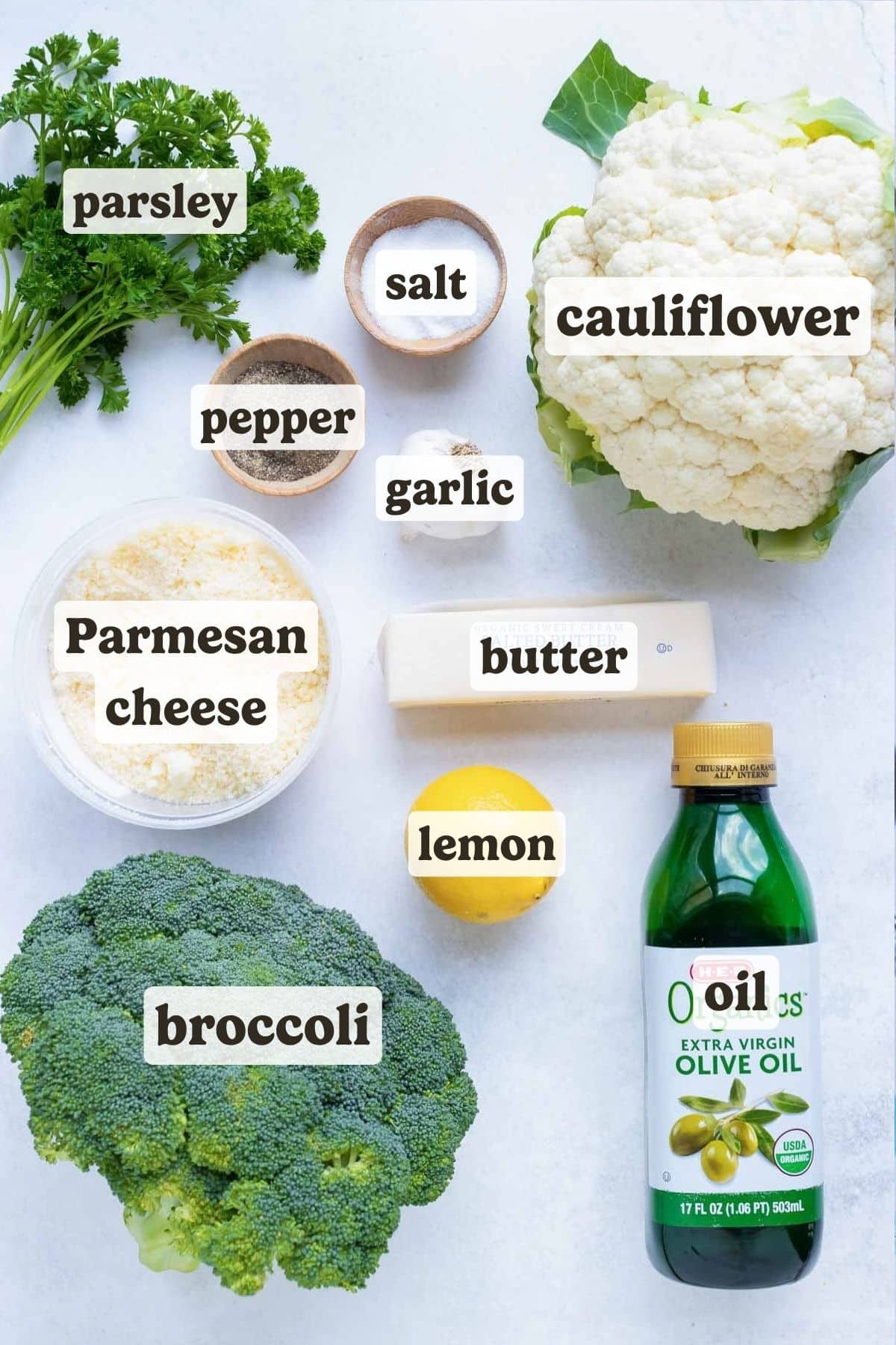 Broccoli, cauliflower, oil, butter, parmesan cheese, and seasoning are the ingredients for this roasted veggie dish.