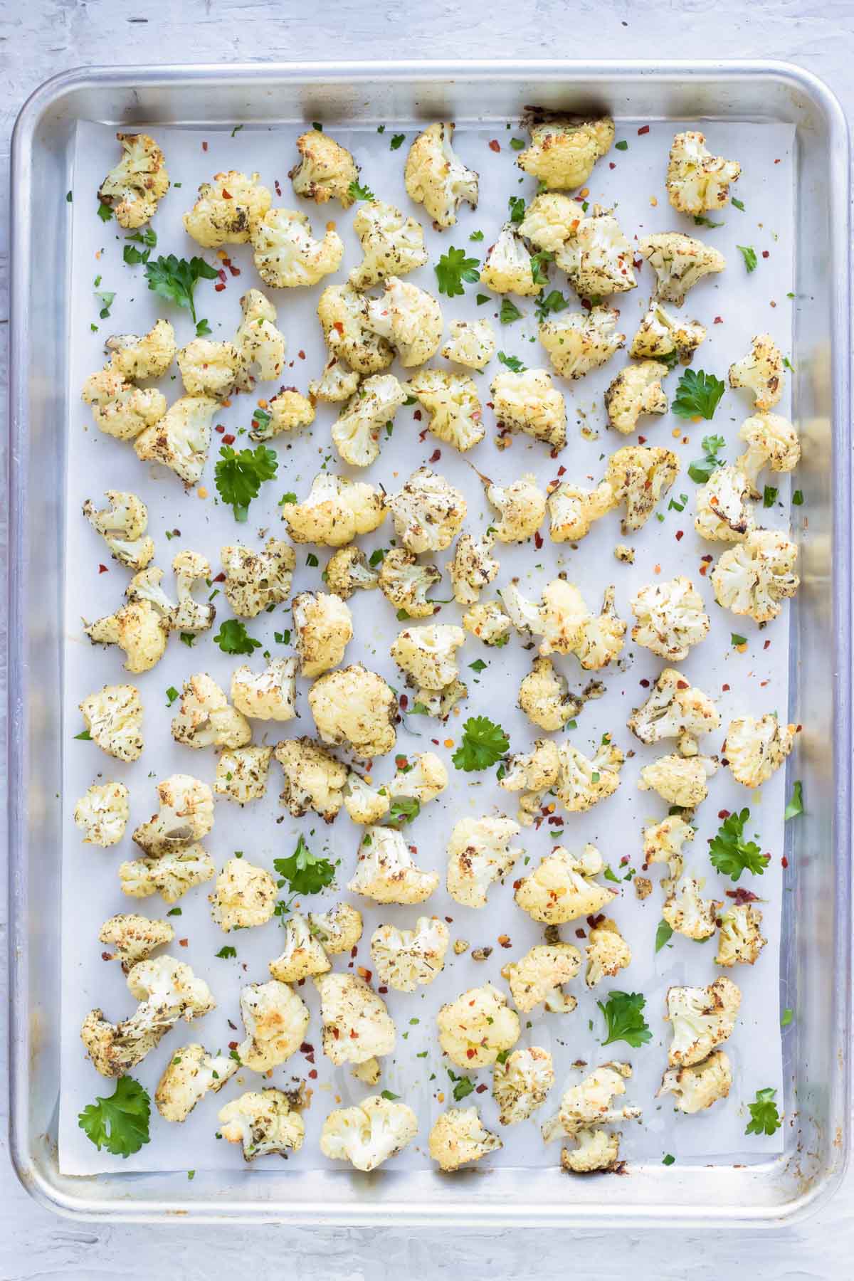 Parmesan Garlic roasted cauliflower recipe on a baking sheet.