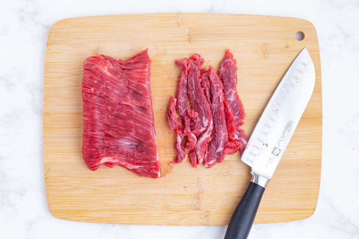 Flank steak is sliced against the grain.