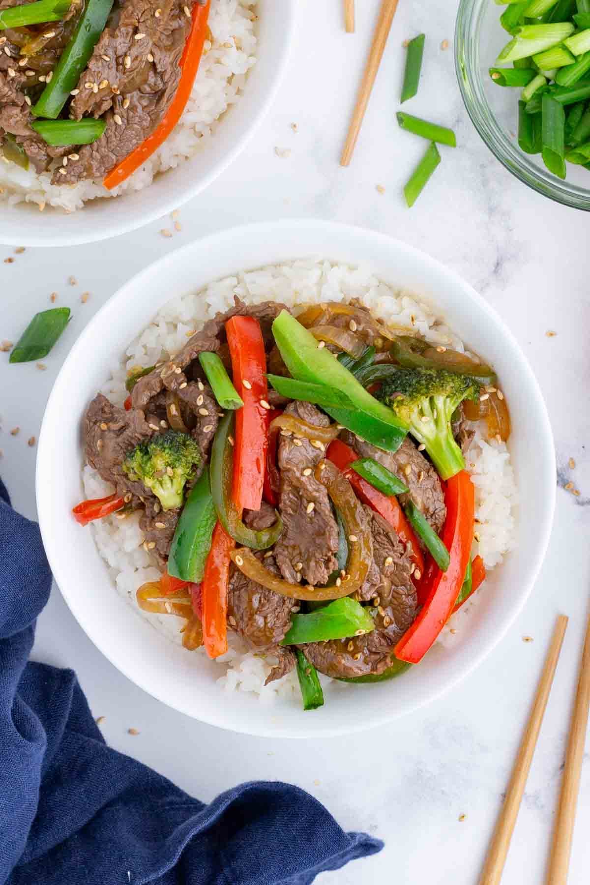 An overhead shot of beef stir fry with rice.