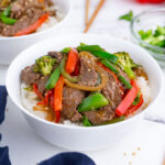 Two bowls with beef stir fry is an easy weeknight dinner.